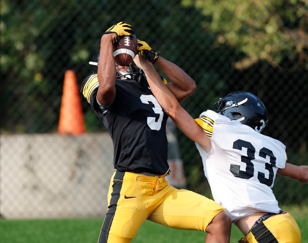 Iowa Hawkeyes wide receiver Tyrone Tracy Jr. (3) and defensive back Riley Moss (33) during camp practice No. 16 Tuesday, August 21, 2018 at the Hansen Football Performance Center. (Brian Ray/hawkeyesports.com)