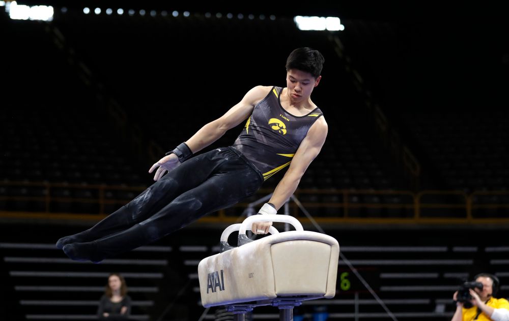 Bennet Huang competes on the pommel horse against Illinois 