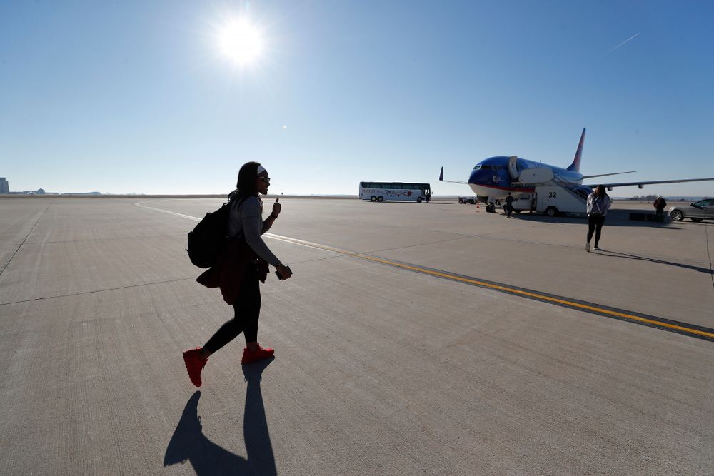 Iowa Hawkeyes guard Zion Sanders (24) walks to the team's plane as they travel to Los Angeles for the first round of the 2018 NCAA Tournament Thursday, March 15, 2018 at the Eastern Iowa Airport. (Brian Ray/hawkeyesports.com)