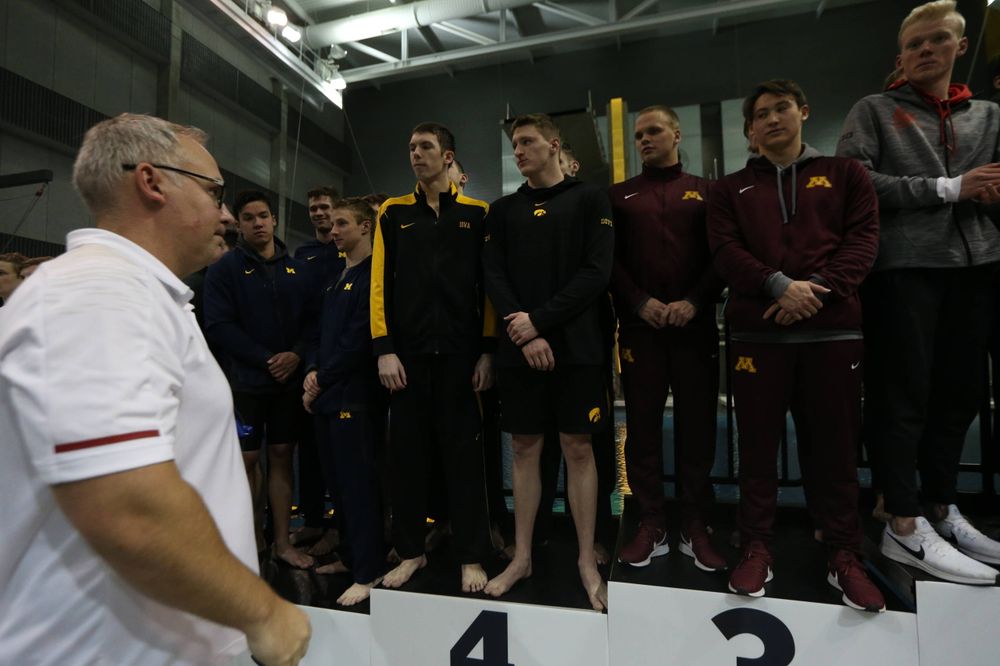 Iowa's  Joe Myhre, Jack Smith, Will Scott, and Steve Fiolic after the 200-yard freestyle relay race  Friday, March 1, 2019 at the Campus Recreation and Wellness Center. (Lily Smith/hawkeyesports.com)
