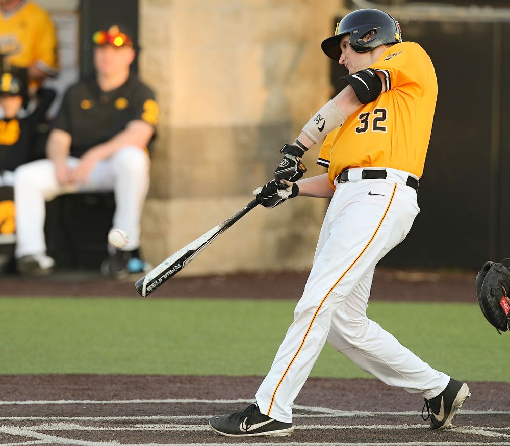 Iowa Hawkeyes catcher Brett McCleary (32) drives a pitch for a hit during the eighth inning of their game against Northern Illinois at Duane Banks Field in Iowa City on Tuesday, Apr. 16, 2019. (Stephen Mally/hawkeyesports.com)