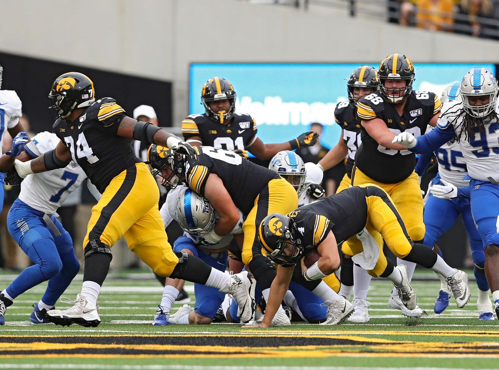Iowa Hawkeyes quarterback Nate Stanley (4) runs for a first down during the first quarter of their game at Kinnick Stadium in Iowa City on Saturday, Sep 28, 2019. (Stephen Mally/hawkeyesports.com)