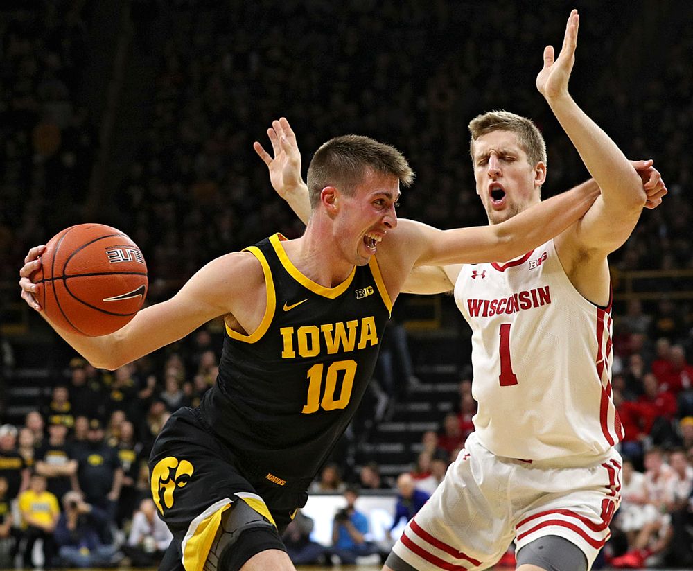 Iowa Hawkeyes guard Joe Wieskamp (10) drives in on Wisconsin Badgers guard Brevin Pritzl (1) with the ball during the second half of their game at Carver-Hawkeye Arena in Iowa City on Monday, January 27, 2020. (Stephen Mally/hawkeyesports.com)