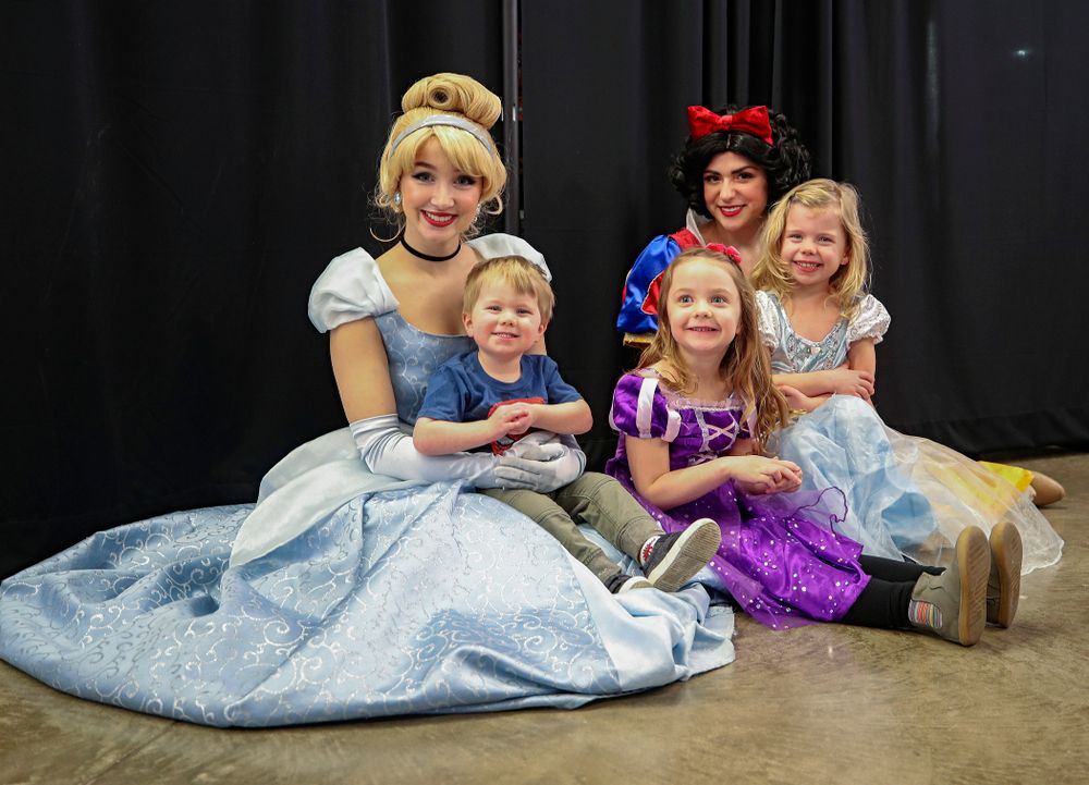 Three young fans get a picture with two princesses on Superhero and Princess Day before the meet at Carver-Hawkeye Arena in Iowa City on Sunday, March 8, 2020. (Stephen Mally/hawkeyesports.com)