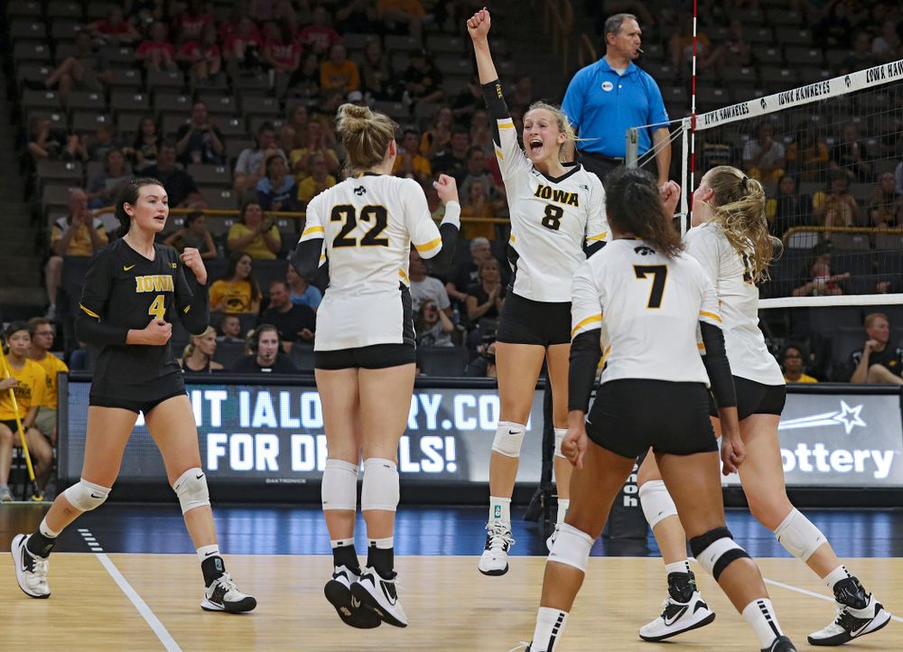 Iowa’s Halle Johnston (4), Jaedynn Evans (22) Brie Orr (7), and Hannah Clayton (18) celebrate with Kyndra Hansen (8) after her kill during the third set of their Big Ten/Pac-12 Challenge match against Colorado at Carver-Hawkeye Arena in Iowa City on Friday, Sep 6, 2019. (Stephen Mally/hawkeyesports.com)