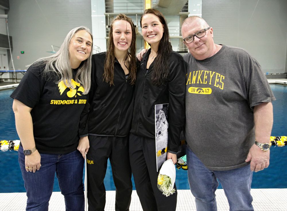 Iowa’s Allyssa Fluit (from left) and Hannah Burvill are honored on senior day before their meet at the Campus Recreation and Wellness Center in Iowa City on Friday, February 7, 2020. (Stephen Mally/hawkeyesports.com)