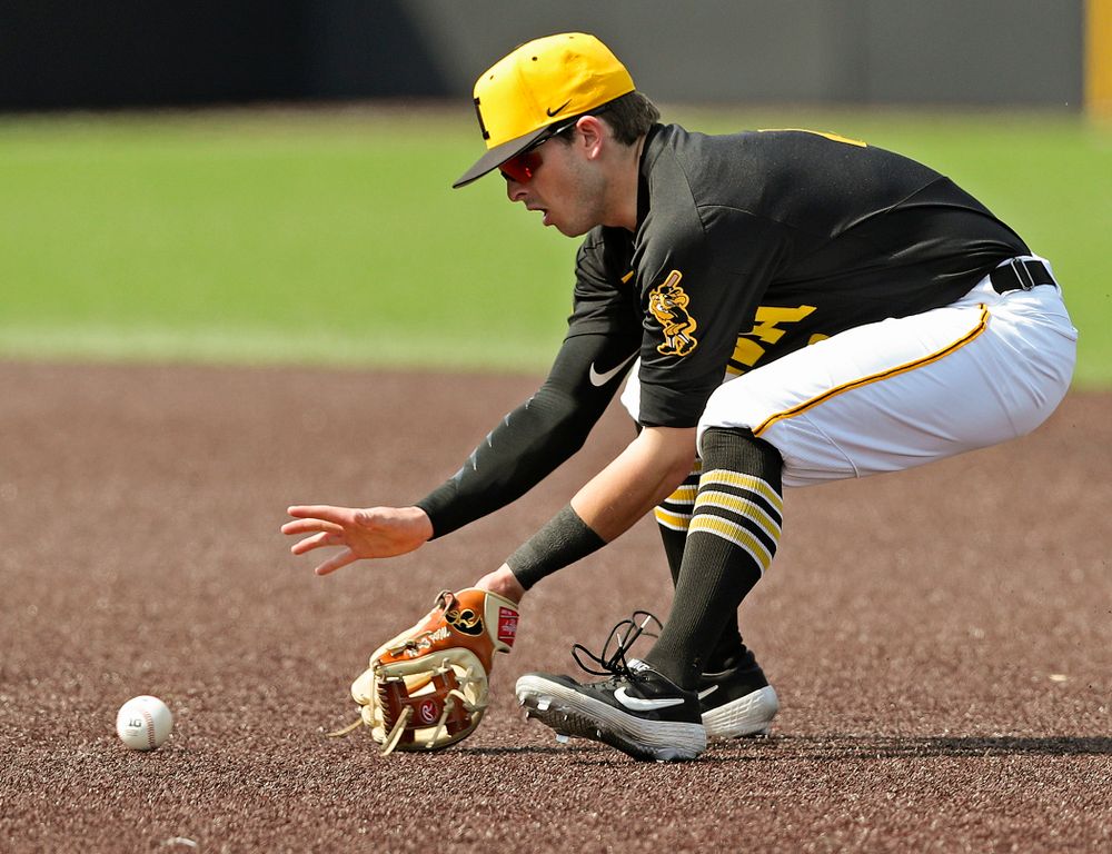 Iowa Hawkeyes second baseman Mitchell Boe (4) fields a ground ball during the third inning of their game against Rutgers at Duane Banks Field in Iowa City on Saturday, Apr. 6, 2019. (Stephen Mally/hawkeyesports.com)