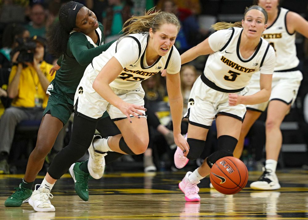 Iowa Hawkeyes guard Kathleen Doyle (22) steals the ball away during the fourth quarter of their game at Carver-Hawkeye Arena in Iowa City on Sunday, January 26, 2020. (Stephen Mally/hawkeyesports.com)