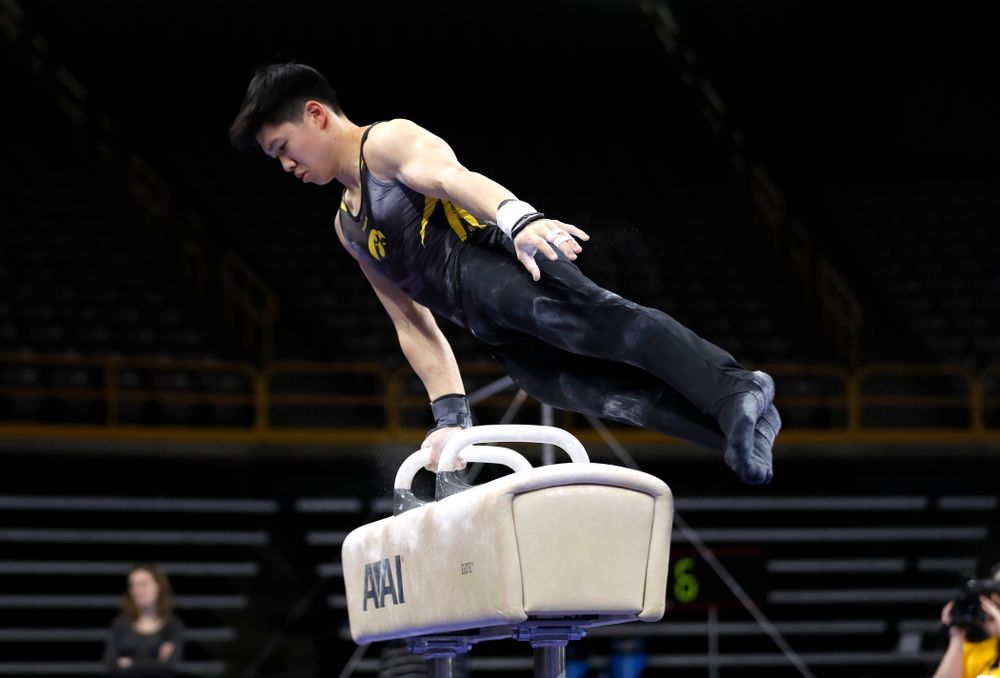 Bennet Huang competes on the pommel horse against Illinois 