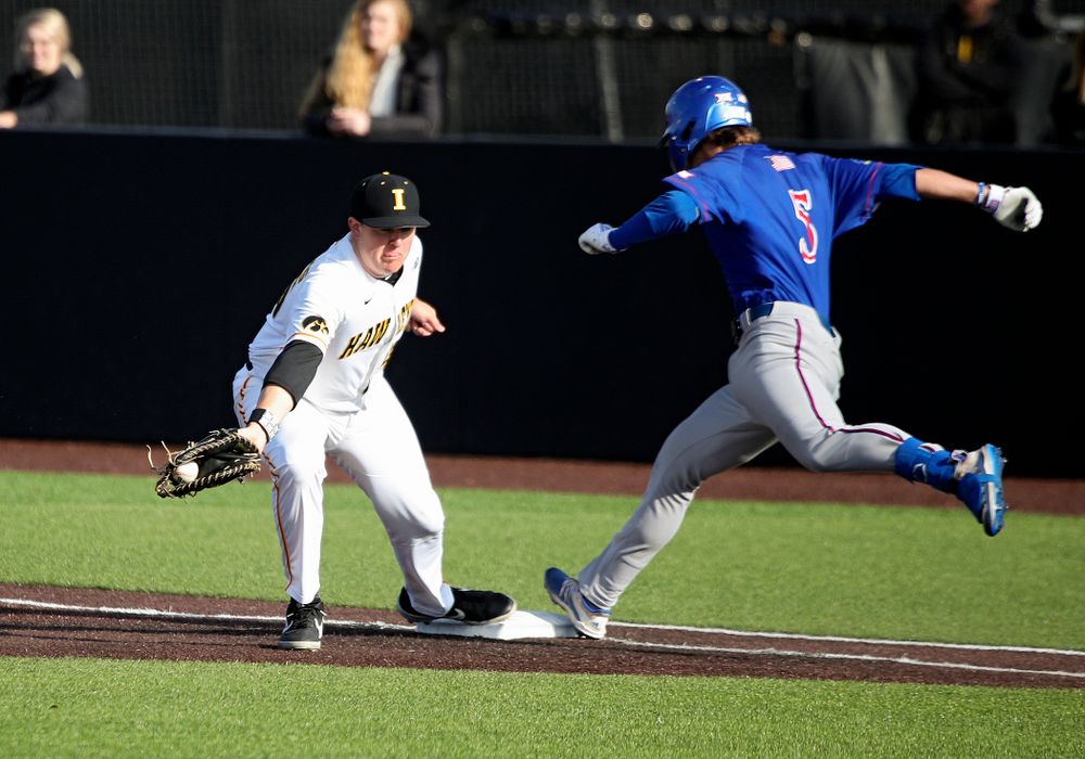 Iowa first baseman Peyton Williams (45) pulls in a throw for an out during the ninth inning of their college baseball game at Duane Banks Field in Iowa City on Wednesday, March 11, 2020. (Stephen Mally/hawkeyesports.com)