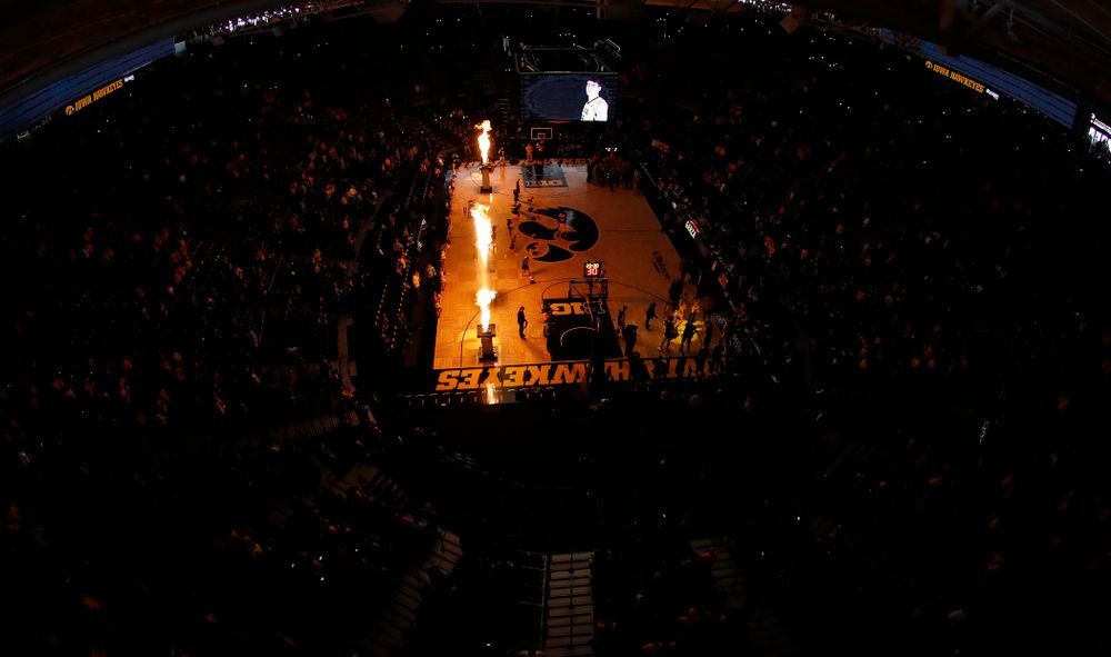 The Iowa Hawkeyes are introduced before their game 
