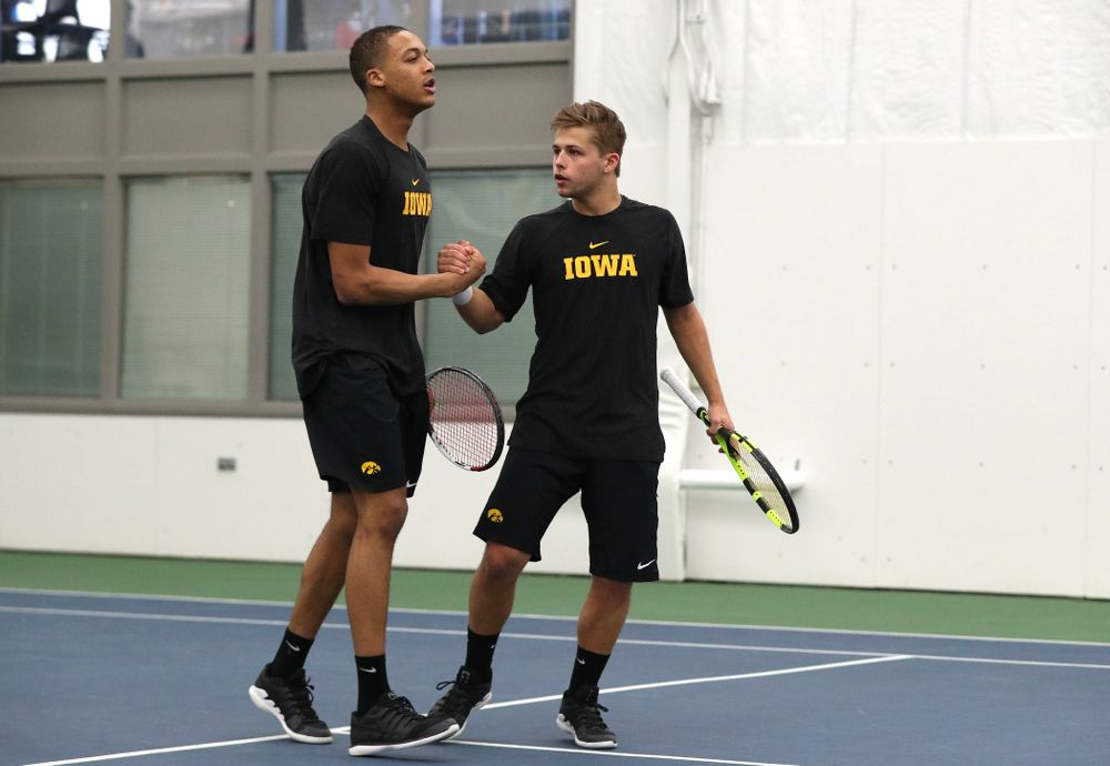 Will Davies and Oliver Okonkwo plays a doubles match against the Miami Hurricanes Friday, February 8, 2019 at the Hawkeye Tennis and Recreation Complex. (Brian Ray/hawkeyesports.com)