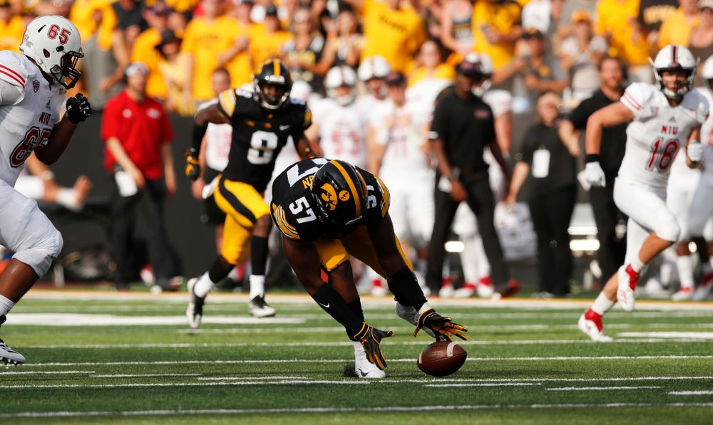 Iowa Hawkeyes defensive end Chauncey Golston (57) scoops up and returns a fumble against the Northern Illinois Huskies Saturday, September 1, 2018 at Kinnick Stadium. (Brian Ray/hawkeyesports.com)