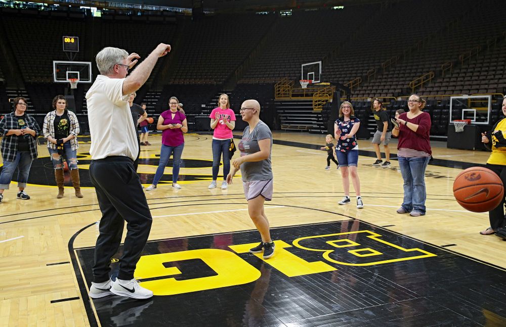 Iowa Hawkeyes head coach Fran McCaffery looks on as visitors from the University of Iowa Hospitals and Clinics Adolescent and Young Adult (AYA) Cancer Program shoot baskets at Carver-Hawkeye Arena in Iowa City on Monday, Sep 30, 2019. (Stephen Mally/hawkeyesports.com)