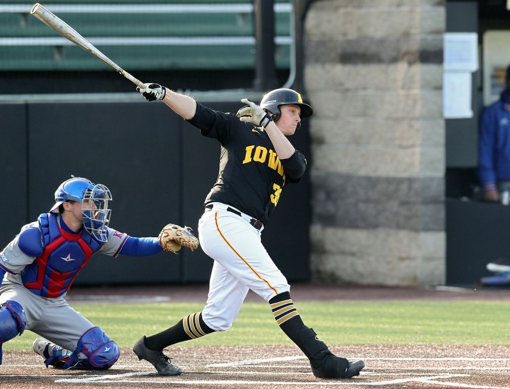Iowa designated hitter Trenton Wallace (38) hits an RBI double during the third inning of their college baseball game at Duane Banks Field in Iowa City on Tuesday, March 10, 2020. (Stephen Mally/hawkeyesports.com)