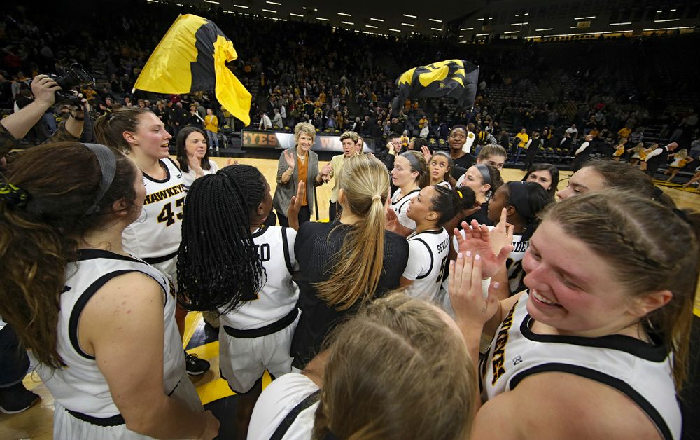The Iowa Hawkeyes celebrate after winning their game at Carver-Hawkeye Arena in Iowa City on Thursday, February 6, 2020. (Stephen Mally/hawkeyesports.com)