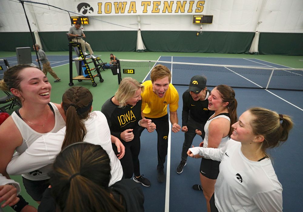 The Hawkeyes celebrate after winning their match at the Hawkeye Tennis and Recreation Complex in Iowa City on Sunday, February 23, 2020. (Stephen Mally/hawkeyesports.com)