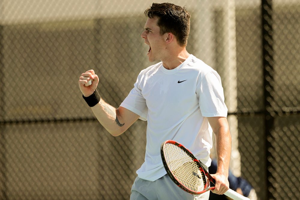 Iowa's Jonas Larson celebrates a point during his match against Michigan at the Hawkeye Tennis and Recreation Complex in Iowa City on Sunday, Apr. 21, 2019. (Stephen Mally/hawkeyesports.com)