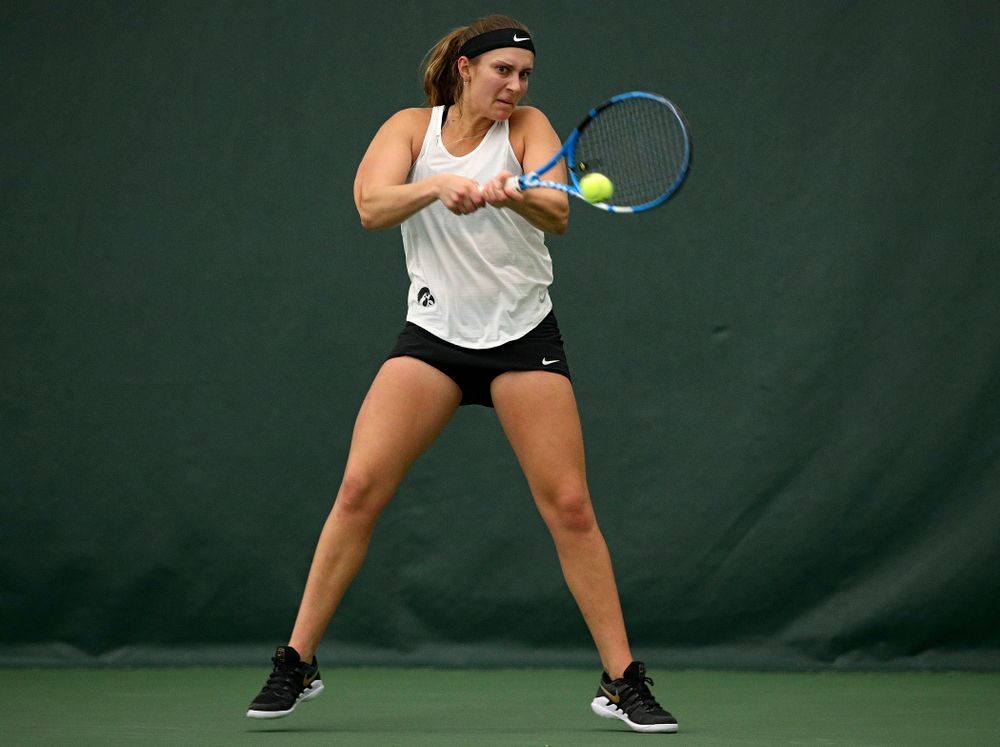 Iowa’s Ashleigh Jacobs returns a shot during her singles match at the Hawkeye Tennis and Recreation Complex in Iowa City on Sunday, February 23, 2020. (Stephen Mally/hawkeyesports.com)