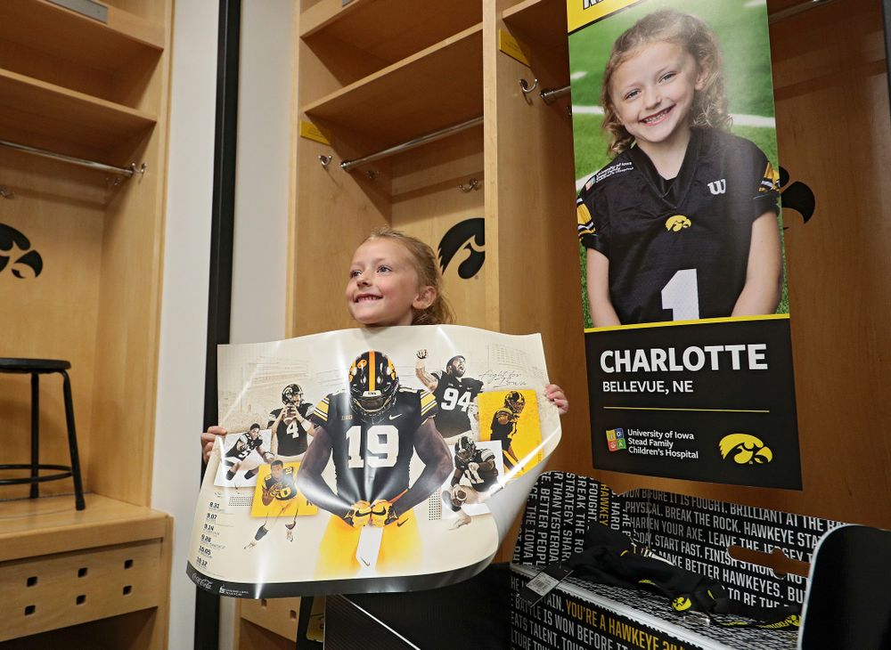 Kid Captain Charlotte Keller holds up a poster during Kids Day at Kinnick Stadium in Iowa City on Saturday, Aug 10, 2019. (Stephen Mally/hawkeyesports.com)