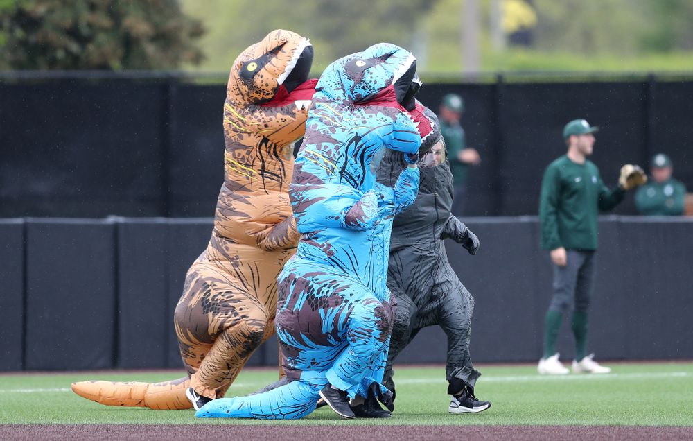 Rachel Heller, Susie Lund, and Emily run the dinosaur race during the Iowa Hawkeyes game against Michigan State Sunday, May 12, 2019 at Duane Banks Field. (Brian Ray/hawkeyesports.com)