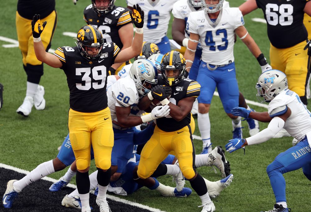 Iowa Hawkeyes tight end Nate Wieting (39) celebrates as running back Mekhi Sargent (10) scores against Middle Tennessee State Saturday, September 28, 2019 at Kinnick Stadium. (Brian Ray/hawkeyesports.com)