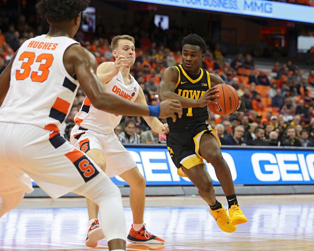 Iowa Hawkeyes guard Joe Toussaint (1) drives with the ball during the first half of their ACC/Big Ten Challenge game at the Carrier Dome in Syracuse, N.Y. on Tuesday, Dec 3, 2019. (Stephen Mally/hawkeyesports.com)