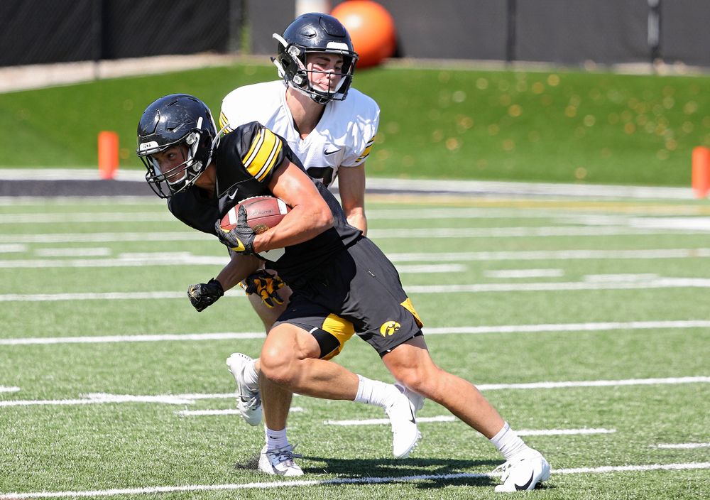 Iowa Hawkeyes wide receiver Oliver Martin (5) tries to get around defensive back Riley Moss (33) during Fall Camp Practice No. 7 at the Hansen Football Performance Center in Iowa City on Friday, Aug 9, 2019. (Stephen Mally/hawkeyesports.com)