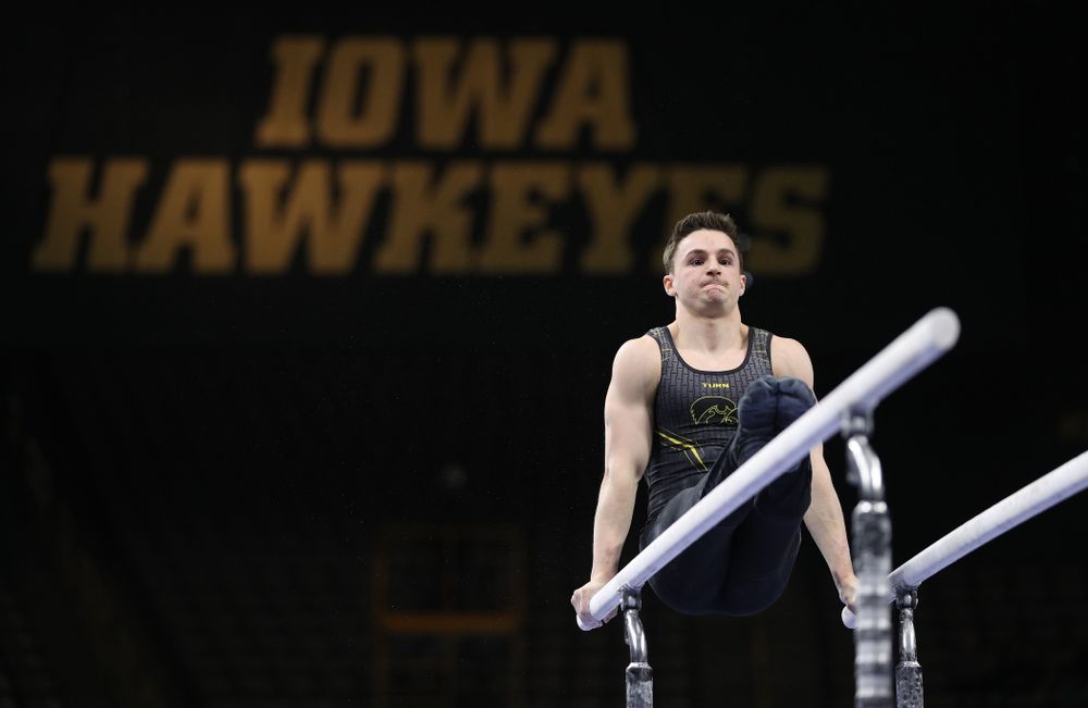 Iowa's Jake Brodarzon competes on the parallel bars against the Ohio State Buckeyes  Saturday, March 16, 2019 at Carver-Hawkeye Arena.  (Brian Ray/hawkeyesports.com)