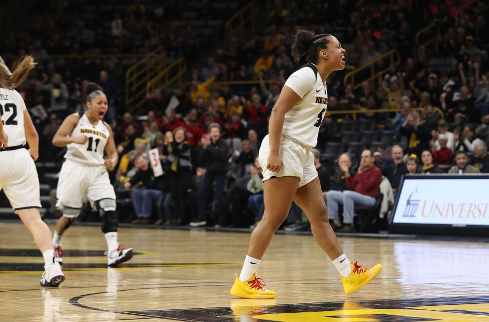 Iowa Hawkeyes guard Alexis Sevillian (5) reacts to an and one by forward Hannah Stewart (21) against the Purdue Boilermakers Sunday, January 27, 2019 at Carver-Hawkeye Arena. (Brian Ray/hawkeyesports.com)