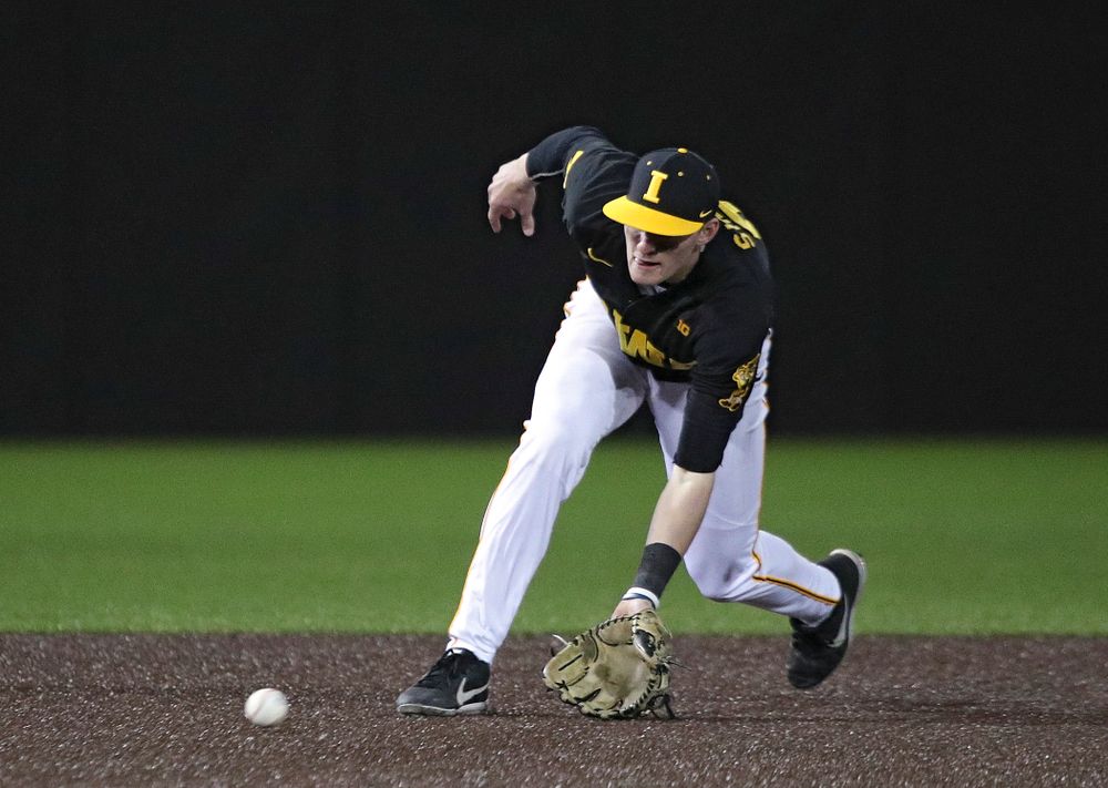 Iowa infielder Brendan Sher (2) fields a ground ball during the ninth inning of their game at Duane Banks Field in Iowa City on Tuesday, March 3, 2020. (Stephen Mally/hawkeyesports.com)