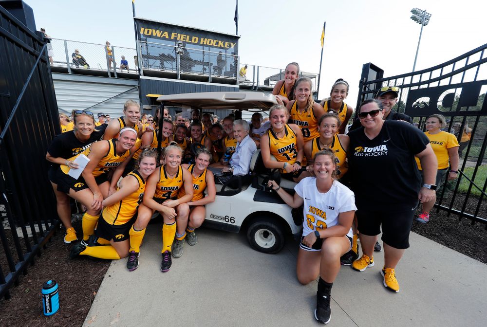Members of the current Iowa Field Hockey Team pose for a photo with Dr. Christine Grant following the Iowa Hawkeyes victory over Indiana Sunday, September 16, 2018 at Grant Field. (Brian Ray/hawkeyesports.com)