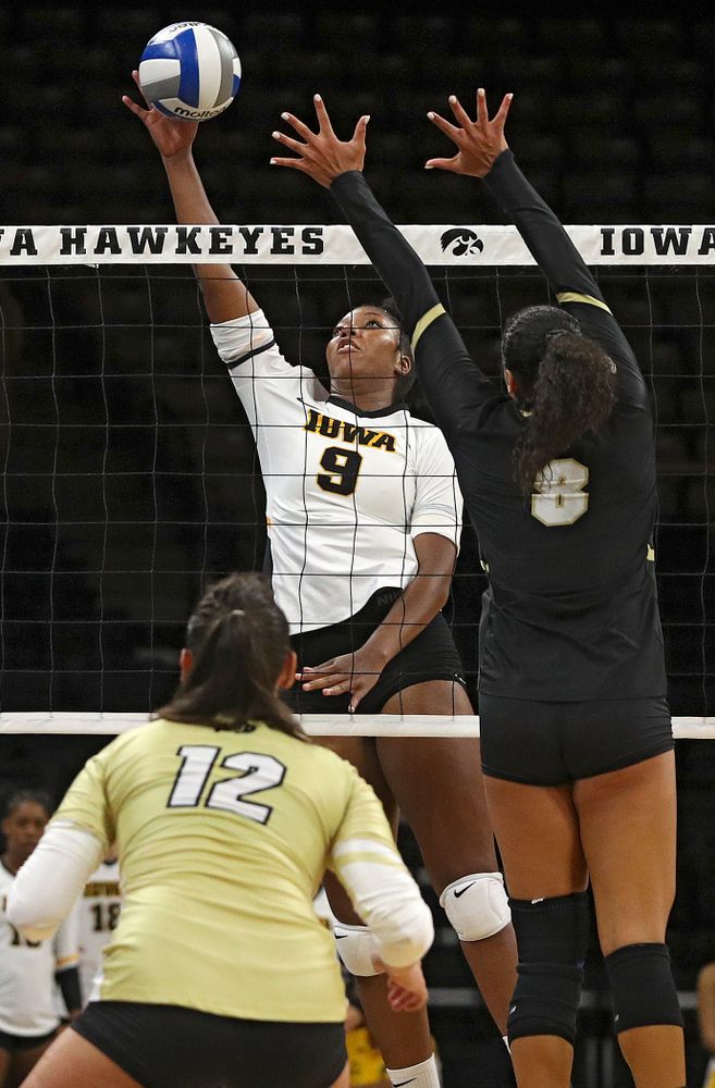 Iowa’s Amiya Jones (9) tips the ball over the net during the third set of their Big Ten/Pac-12 Challenge match against Colorado at Carver-Hawkeye Arena in Iowa City on Friday, Sep 6, 2019. (Stephen Mally/hawkeyesports.com)