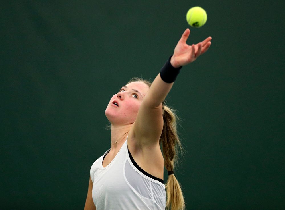 Iowa’s Danielle Burich serves during her singles match at the Hawkeye Tennis and Recreation Complex in Iowa City on Sunday, February 23, 2020. (Stephen Mally/hawkeyesports.com)