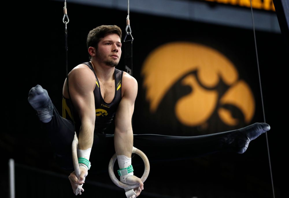 Rogelio Vazquez competes on the rings against Minnesota and Air Force 