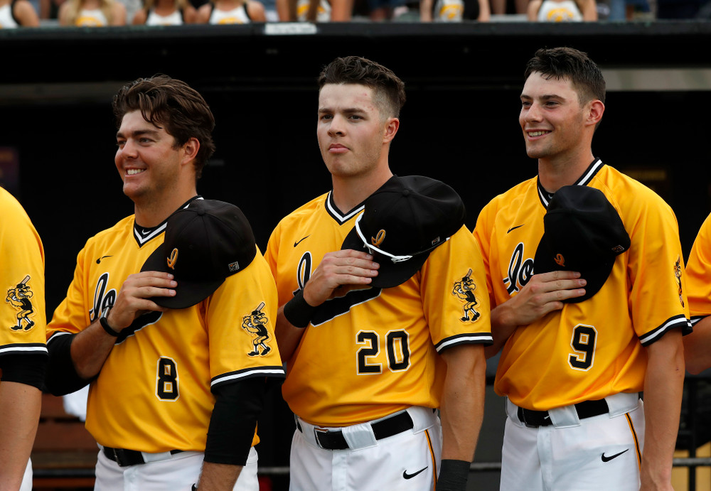 Iowa Hawkeyes catcher Austin Guzzo (20) stands for the Canadian National Anthem  before their game against the Penn State Nittany Lions Saturday, May 19, 2018 at Duane Banks Field. (Brian Ray/hawkeyesports.com)