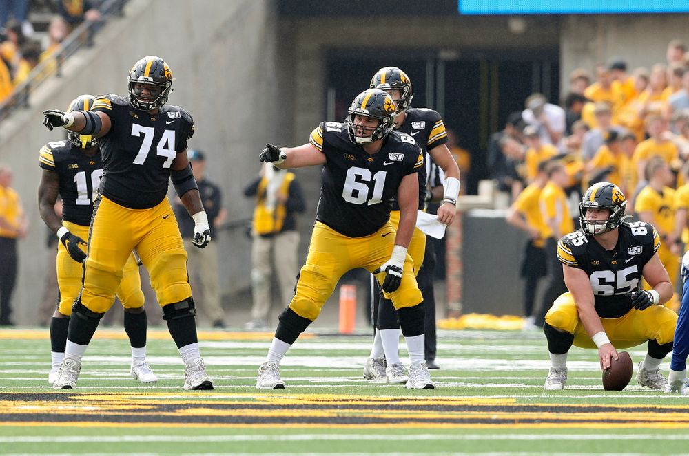 Iowa Hawkeyes offensive lineman Tristan Wirfs (74) and offensive lineman Cole Banwart (61) point before a snap during the second quarter of their game at Kinnick Stadium in Iowa City on Saturday, Sep 28, 2019. (Stephen Mally/hawkeyesports.com)