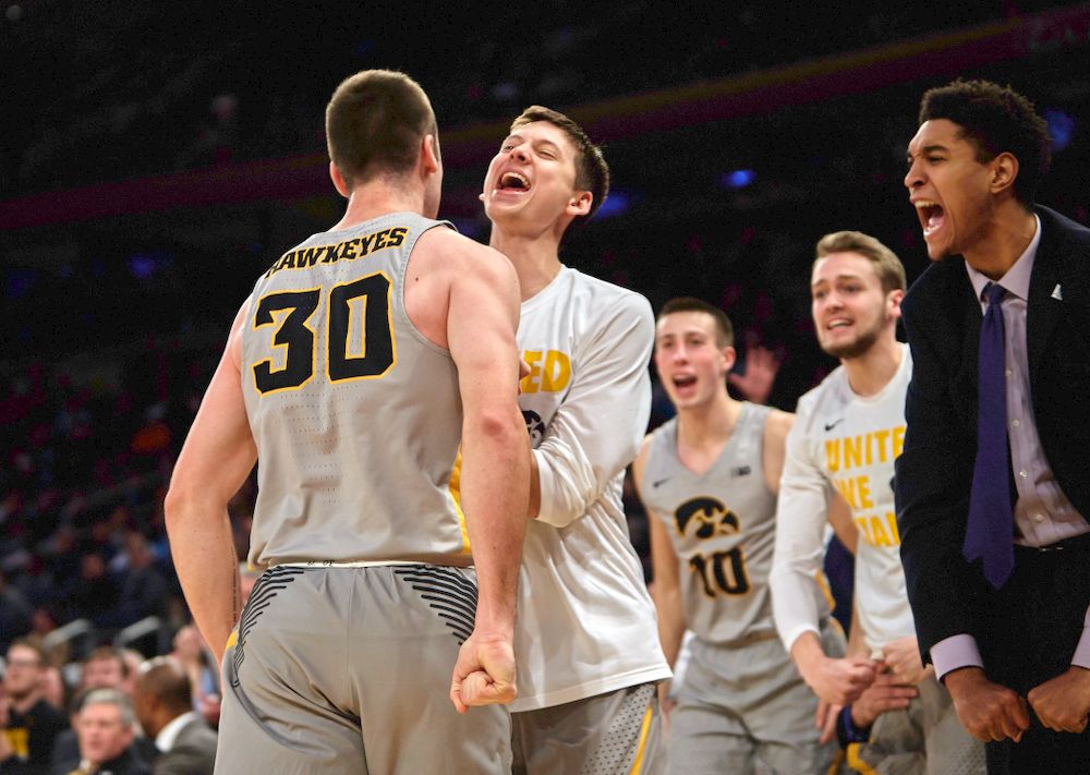 Iowa Hawkeyes guard Connor McCaffery (30) and Iowa Hawkeyes guard Austin Ash (13) against UConn in the Championship game of the 2K Empire Classic Friday, November 16, 2018 at Madison Square Garden in New York City. (Duncan H.Williams/Freelance)