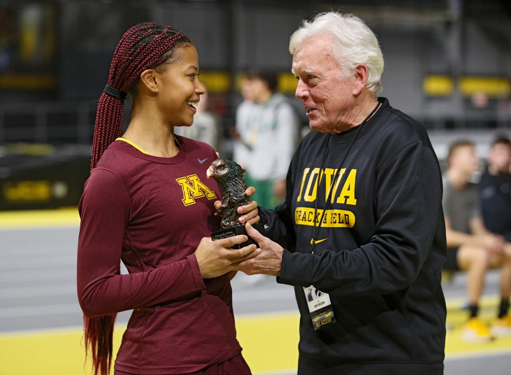 Larry Wieczorek hands out an award during the Larry Wieczorek Invitational at the Recreation Building in Iowa City on Saturday, January 18, 2020. (Stephen Mally/hawkeyesports.com)
