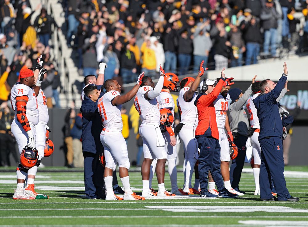 Illinois Fighting Illini players and staff wave to the University of Iowa Stead Family Children's Hospital between the first and second quarter of their game at Kinnick Stadium in Iowa City on Saturday, Nov 23, 2019. (Stephen Mally/hawkeyesports.com)