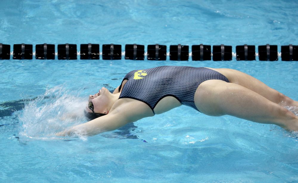 IowaÕs Emilia Sansome competes in the 100 yard backstroke against Notre Dame and Illinois Saturday, January 11, 2020 at the Campus Recreation and Wellness Center.  (Brian Ray/hawkeyesports.com)