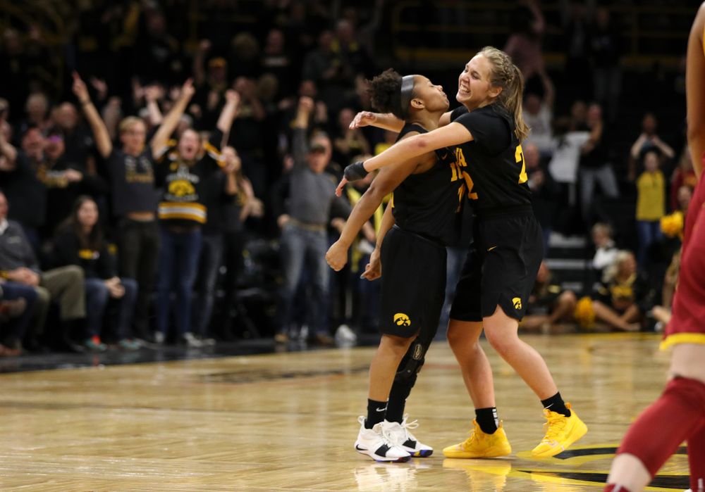 Iowa Hawkeyes guard Tania Davis (11) celebrates with guard Kathleen Doyle (22) after making the game winning three point basket against the Iowa State Cyclones in the Iowa Corn Cy-Hawk Series Wednesday, December 5, 2018 at Carver-Hawkeye Arena. (Brian Ray/hawkeyesports.com)