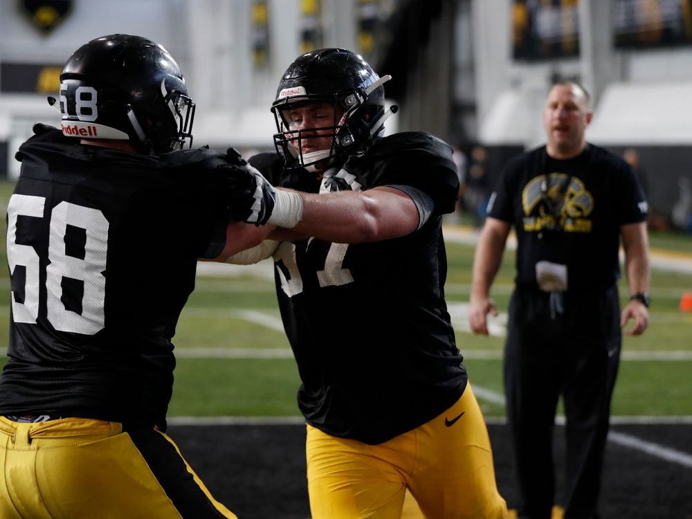 Iowa Hawkeyes offensive lineman Jake Newborg (58) and offensive lineman Levi Duwa (67) during spring practice  Thursday, March 29, 2018 at the Hansen Football Performance Center. (Brian Ray/hawkeyesports.com)