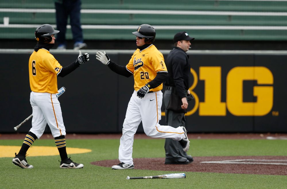 Iowa Hawkeyes catcher Austin Guzzo (20) and outfielder Justin Jenkins (6) against the Ohio State Buckeyes Sunday, April 8, 2018 at Duane Banks Field.(Brian Ray/hawkeyesports.com)
