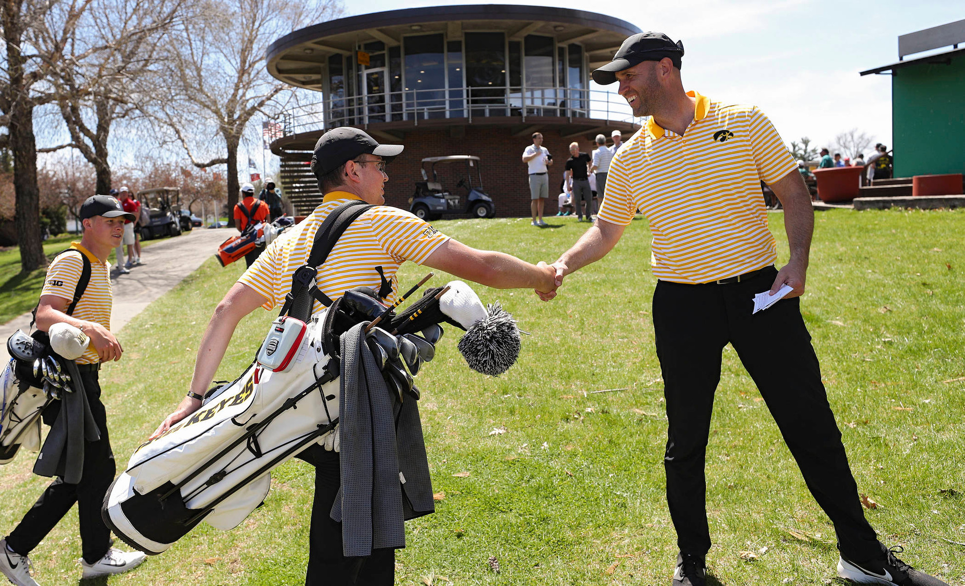 af053a2a-04212019_iowa_mens_golf_hawkeye_invitational_52.JPG Iowa's Matthew Walker (from left) shakes hands with head coach Tyler Stith after finishing his round during the third round of the Hawkeye Invitational at Finkbine Golf Course in Iowa City on Sunday, Apr. 21, 2019. (Stephen Mally/hawkeyesports.com)