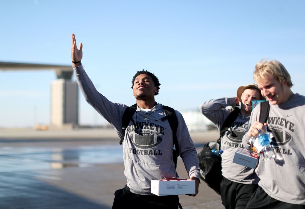 Iowa Hawkeyes wide receiver Tyrone Tracy Jr. (3) boards the team plane at the Eastern Iowa Airport Saturday, December 21, 2019 on the way to San Diego, CA for the Holiday Bowl. (Brian Ray/hawkeyesports.com)
