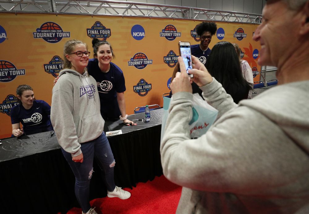 Iowa Hawkeyes forward Megan Gustafson (10) signs autographs with the other WBCA All Americans at the Tourney Town Fan Fest Friday, April 5, 2019 at the Tampa Convention Center in Tampa, FL. (Brian Ray/hawkeyesports.com)