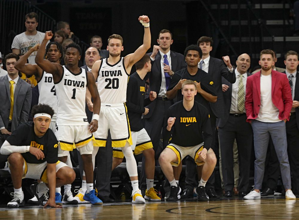 The Iowa bench celebrates after a stop during the second half of the game at Carver-Hawkeye Arena in Iowa City on Sunday, February 2, 2020. (Stephen Mally/hawkeyesports.com)