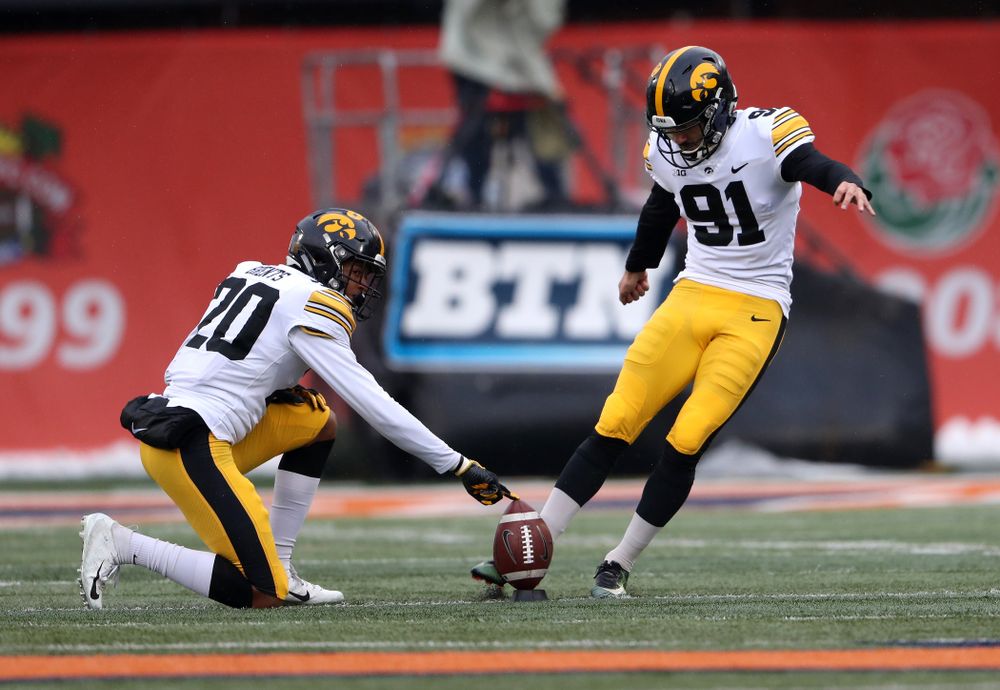 Iowa Hawkeyes place kicker Miguel Recinos (91) and defensive back Julius Brents (20) against the Illinois Fighting Illini Saturday, November 17, 2018 at Memorial Stadium in Champaign, Ill. (Brian Ray/hawkeyesports.com)