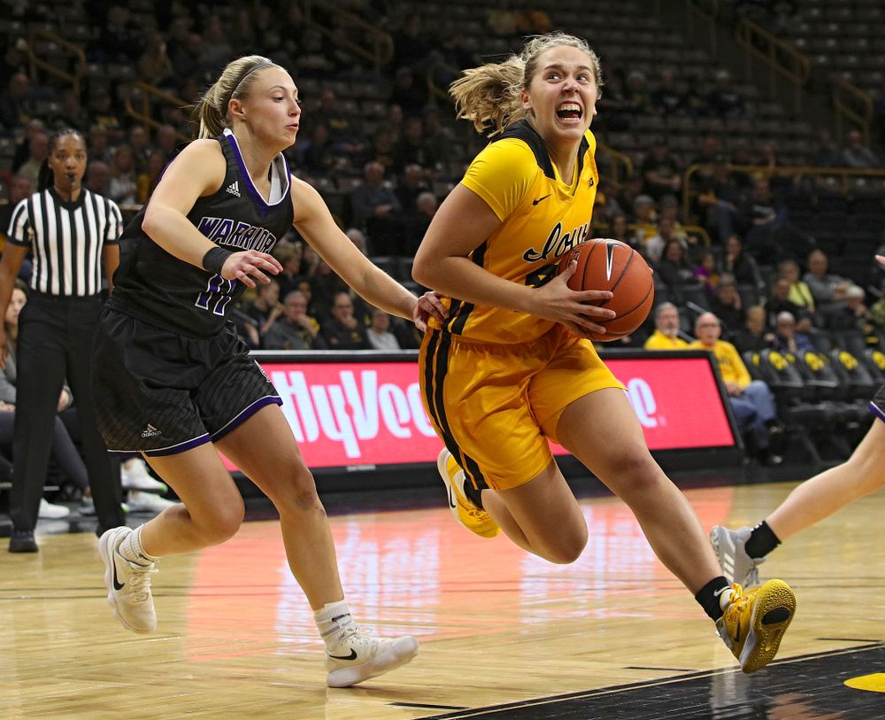 Iowa guard Kathleen Doyle (22) drives in with the ball during the third quarter of their game against Winona State at Carver-Hawkeye Arena in Iowa City on Sunday, Nov 3, 2019. (Stephen Mally/hawkeyesports.com)